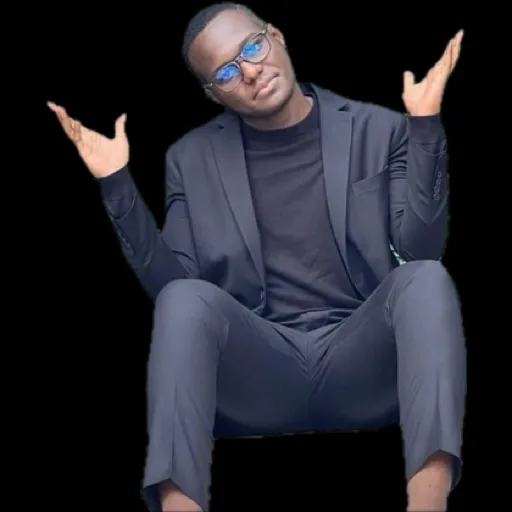 Msaa in a suit, sitting and shrugging with both hands up
